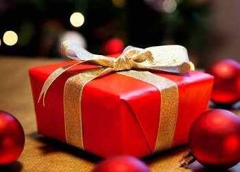 wrapped christmas present with gold bow