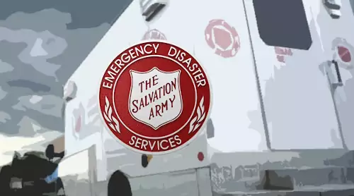 salvation army shield for emergency disaster over image of truck